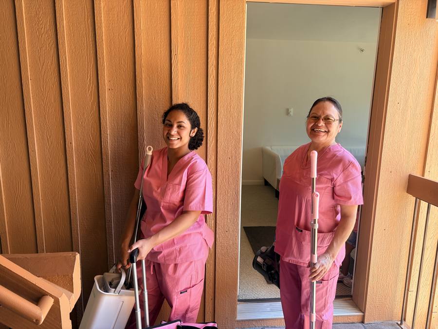 Two smiling Animas Cleaning team members on site at a Durango property