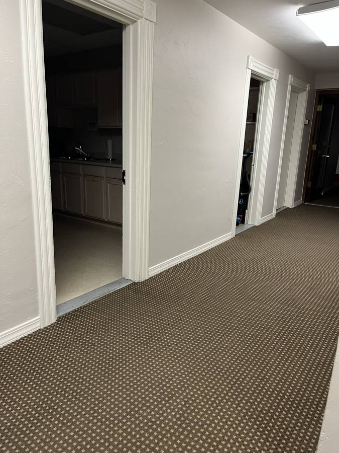 Freshly vacuumed hallway carpet and cleaned kitchenette in Durango, Colorado
