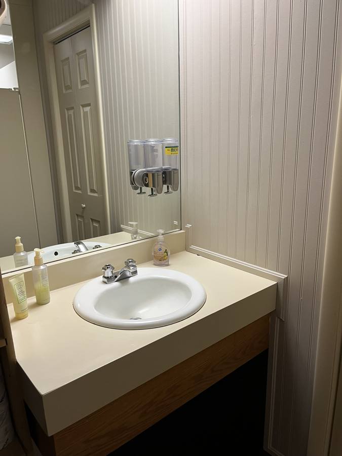 Spotless bathroom vanity and mirror after a deep cleaning